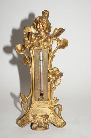 Art Nouveau Dore Bronzed Figural Thermometer: Dore brozed metal thermometer with head of a young woman; 9in. H.