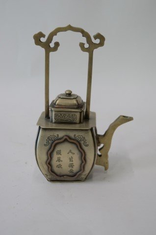 Chinese Bronze Teapot: Marked at the bottom with four character mark. Calligraphy "story" in two panels on two sides. High handle. 7 1/2"H.