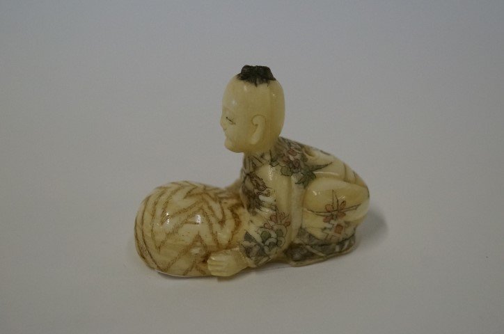 19th C. Carved Ivory Netsuke: Signed with red mark at the bottom. 2 1/4" x 1 3/4"H.