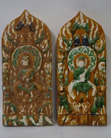 Pair of Chinese Tang Style Glazed Ceramic Plaques: Pair of three(3) color glazed stoneware temple plaques. Decorated with buddha and foo dogs in high relief; 31in. H. X 13.5in. W.