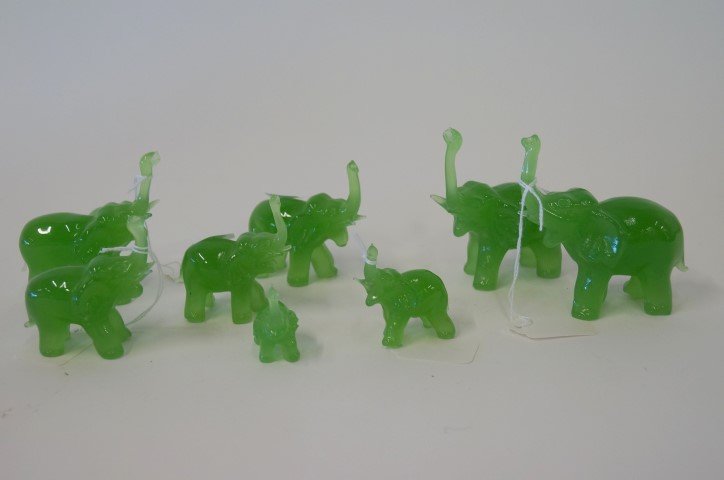 Peking Glass Elephants (8): Collection of eight glass elephants with raised trunks. Three large, three medium and three small. 3 3/4", 3" and 2" H.