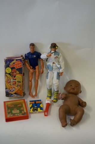 Dealer's Lot of Toys (7): Hasbro jointed hard rubber action figure, USCG Law Enforcement; Lanard Toy Co. action figure, The Ultra Corps; 1977 Batman DC Comics cards in box; a Santa Pez dispenser; a Pigybak puzze game and a Nad