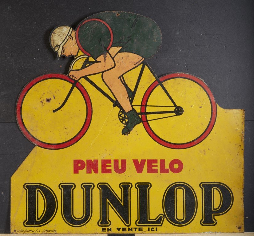 Dunlop Double Sided Sign: French. Lithography on Tin. Condition: Has holes as a result of mounting and some paint loss.; 21" x 22"