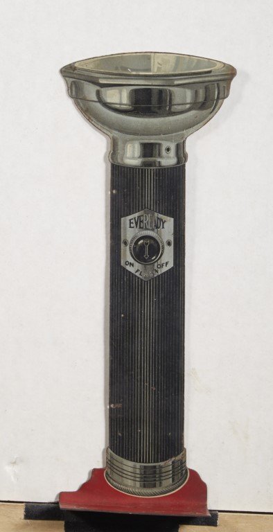Eveready Flashlight Sign: Flange sign. Flashlight cut-out. Lithography on metal. ; 10 1/2" x 4"