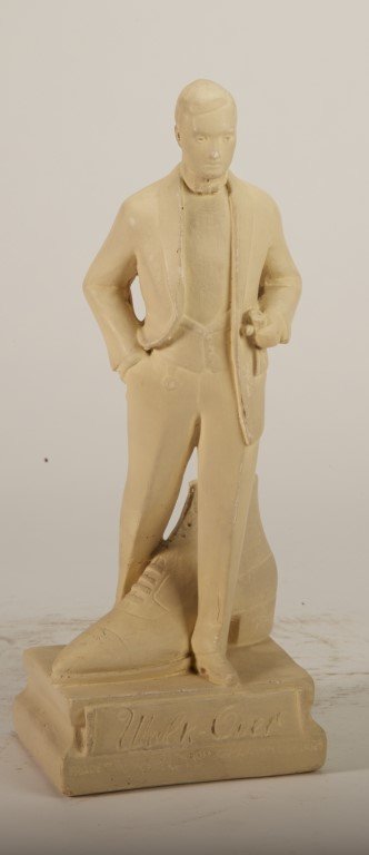 Walk-Over Shoes Statuette: Male figure with large shoe. Plaster painted white. ; 12 1/2" x 4 1/2"