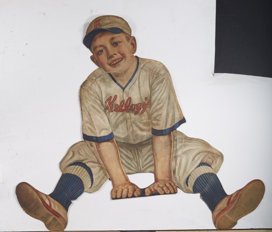 Kellogg's Diecut Sign: Lithography on cardboard. Rare early advertising sign for Kellogg's. Condition: Some creases that may be visible in photograph ; 26" x 30"