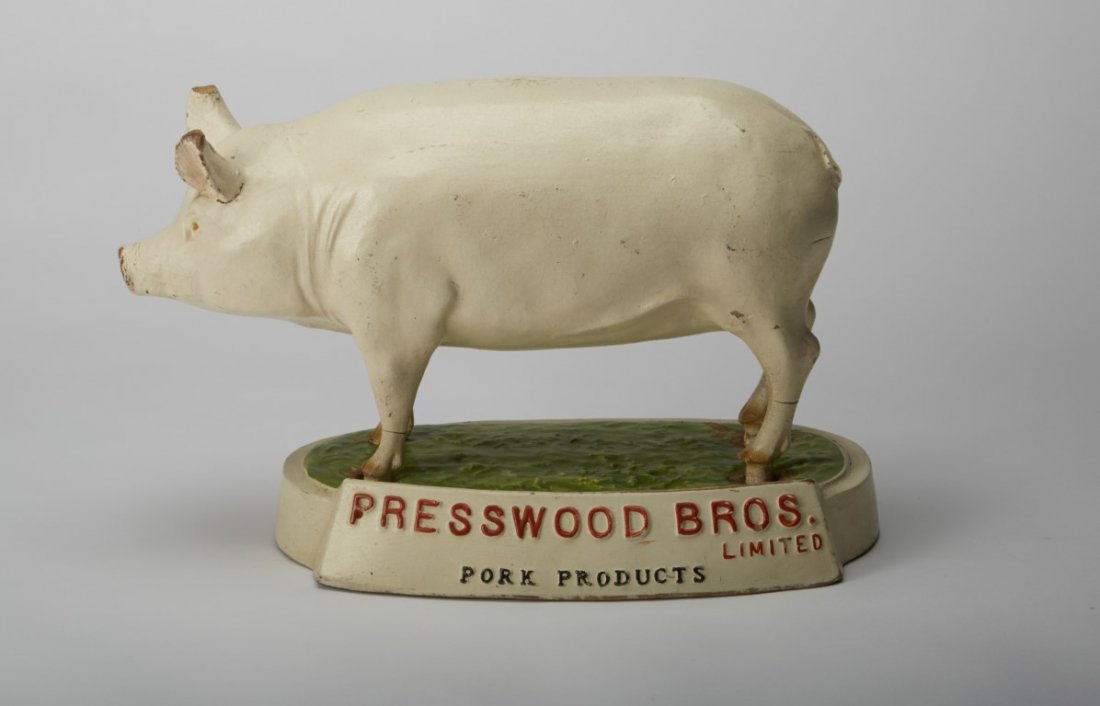 Presswood Bros. Provisions Display: Pork Products" Painted Wood on a plaster mount. Condition: Some paint loss, normal age wear ; 8 x 11