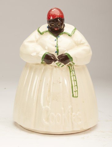 McCoy Mammy Cookie Jar: Marked McCoy at bottom. Condition: Minor paint loss to the head scarf, Minor base chip. ; 11 1/4"