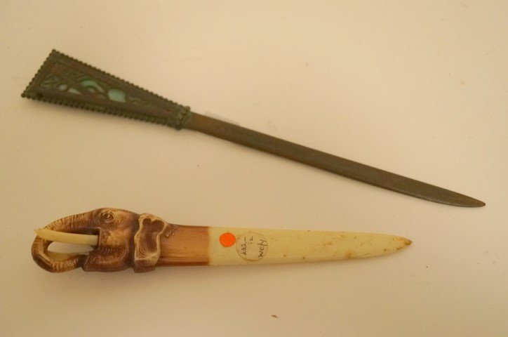 Two Letter Openers: One a grapevine pattern, bronze and slag glass sgd. Riviere Studios and one French elephant bakelite opener marked Depose. 10 1/2": and 7 1/2"