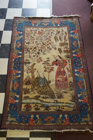Rare Persian Antique Kashan Carpet: One directional pictorial design. Vegtable dyed. Approximately 289 knots per square inch. Lelee and Majnoon design including human figures, flowers and trees Reportedly woven by Mohammed Dabiy Al Mana