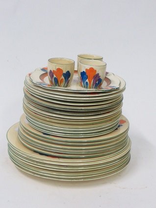 Clarice Cliff Bizarre Line Crocus: Six plates; eight plates; sixteen plates; an undertray with three egg cups ( undertray has fittings for four egg cups but we only have three and the undertray has a line in it) . 34 pcs. In the lot. 6