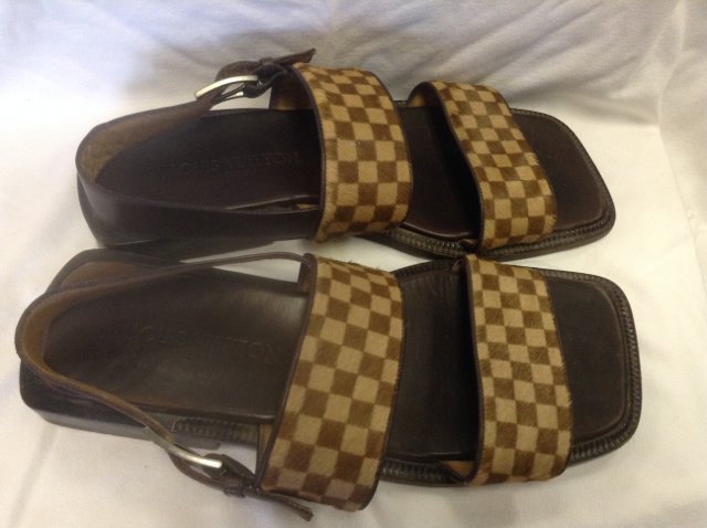 Louis Vuitton Pony Skin Sandles: Size 9. Marked Louis Vuitton Paris at the heel; marked on the buckle; marked at the base. In worn condition. 12" long