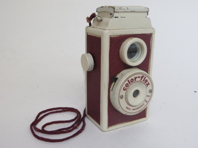 Color-Flex Camera: Brown and White. Graf Lens 50 mm. Carrying strap