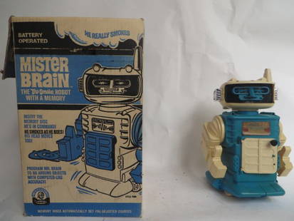 Mister Brain  Robot 1970: Battery Operated. Remco Industries Inc. Harrison, N.J. "He Smokes As He Goes..His Head Moves Too" With Memory Disc. Original box (box is as is) 11"H.