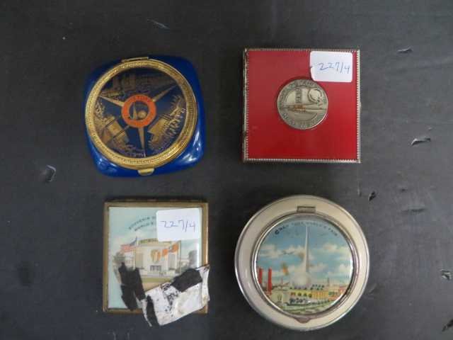 New York 1939 World's Fair Compacts (4): New York World's Fair, 1939, circular, pastel colored central view; New York World's Fair, cobalt view with various scenes of the Fair on the lid; New York World''s Fair, 1939, red with silver colored