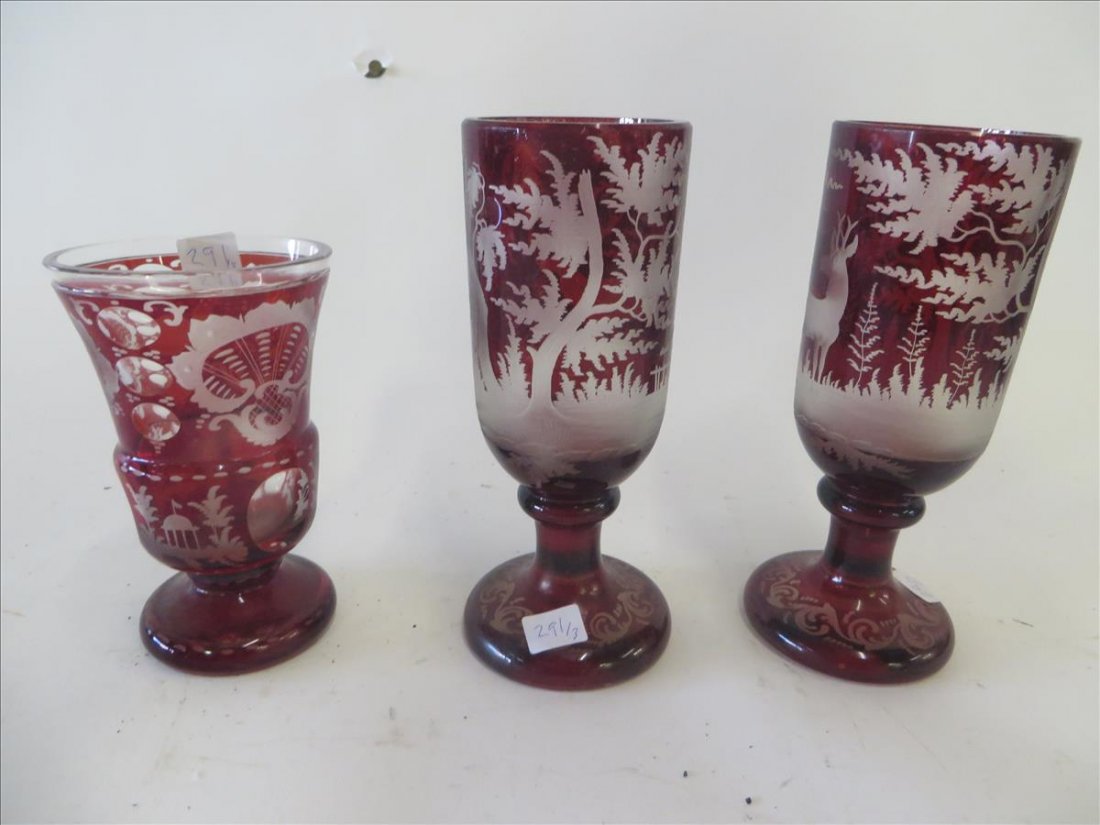 Bohemian Ruby Intaglio Cut Pieces: Two pedestaled goblet, each with a deer in a landscape setting and one a footed vase, also with deer in landscape setting at the bottom panels 8 "H. 3 1/2" opening; the vase is 6"H. and 3 1/2" opening