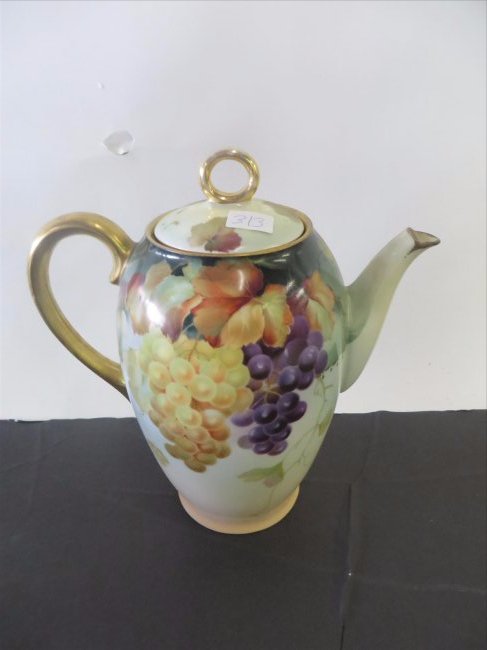 Hand Painted Sevres Teapot: Marked Thomas. Sevres. Bavaria. Well detailed floral painted decorations. Gilded loop handle. 10"H