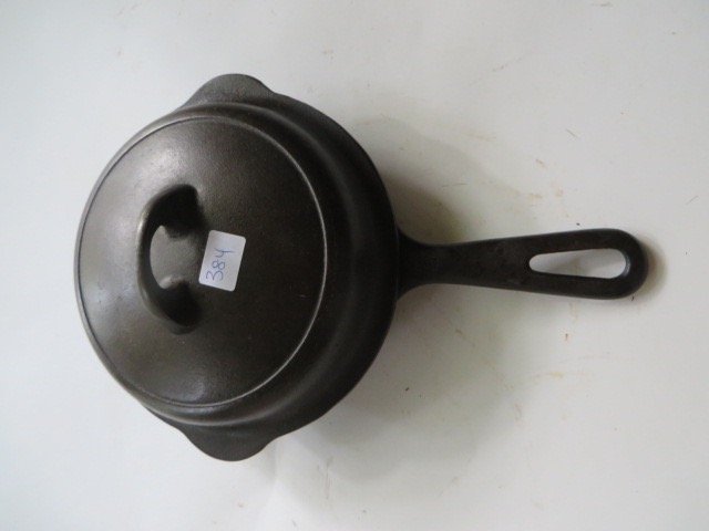 Griswold Cast Iron Covered Skillet .: No. 3 Erie, Pa., 709 J perhaps but difficult to read. On the lid on the interior marked with a raised 3. Self Basting with a Pat. No. 133020921554360 1093
