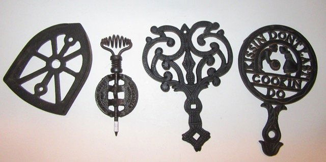 Cast Iron Lot (4): trivets, Sadiron holder and Stove Part. Varying Sizes