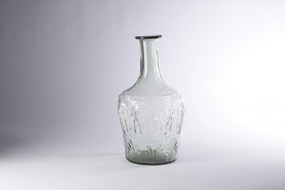 George Washington Flask. C. 1800-1825: Hand blown with eight sides. Washington portrait, blown. Green toned glass. C. 1800-1825 Purchased from Leonard Balish in Feb. 1973. 11 1/2"H