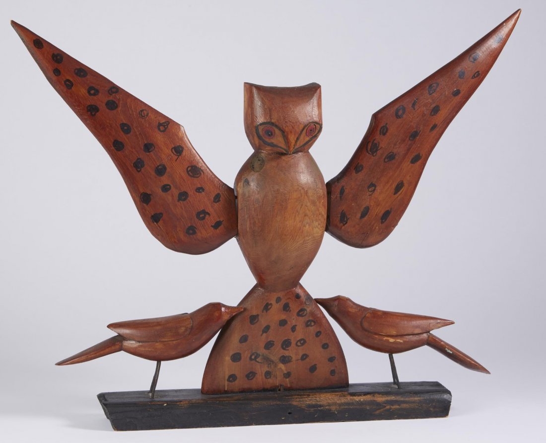 Owl Group Attr. to Zahn, Dorr County: Carved and painted wood owl group attributed to Zahn, Dorr County, Wisconsin. A frontal view of an owl with spread wings flanked by two small standing birds, the whole mounted on a wood base. Purchase