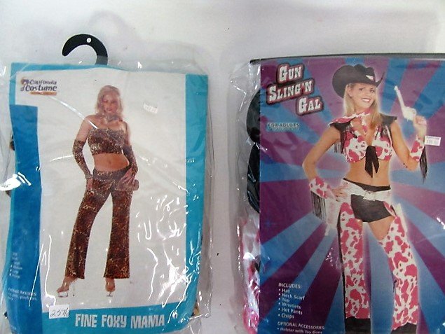 Vintage Halloween Costumes (13): Female costumes. Adult size. Fine Foxy Mama. Perky Witch. Reno 911. Very Witchy Witch. Pimp Lady. Gun Slinging Gal. Some bearing original price tags $40-$60 Thirteen in the lot.