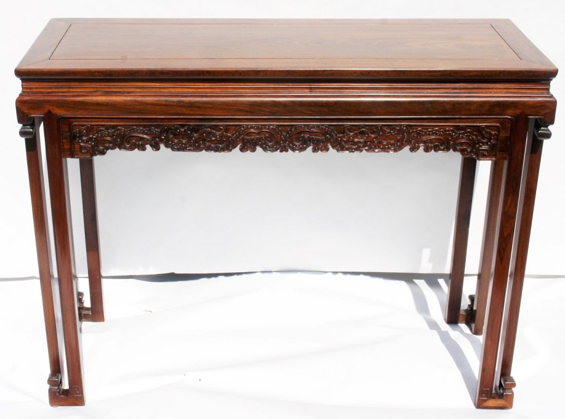 Chinese Rosewood Altar Table: Antique rosewood altar table. Carved sides; 33in.H. x 44in.W. x 16in.D.
