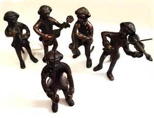 Bronze Monkey Band (5): A conductor, a guitar player, a violinist, a trombone player and a saxophone player. All about 5"H.