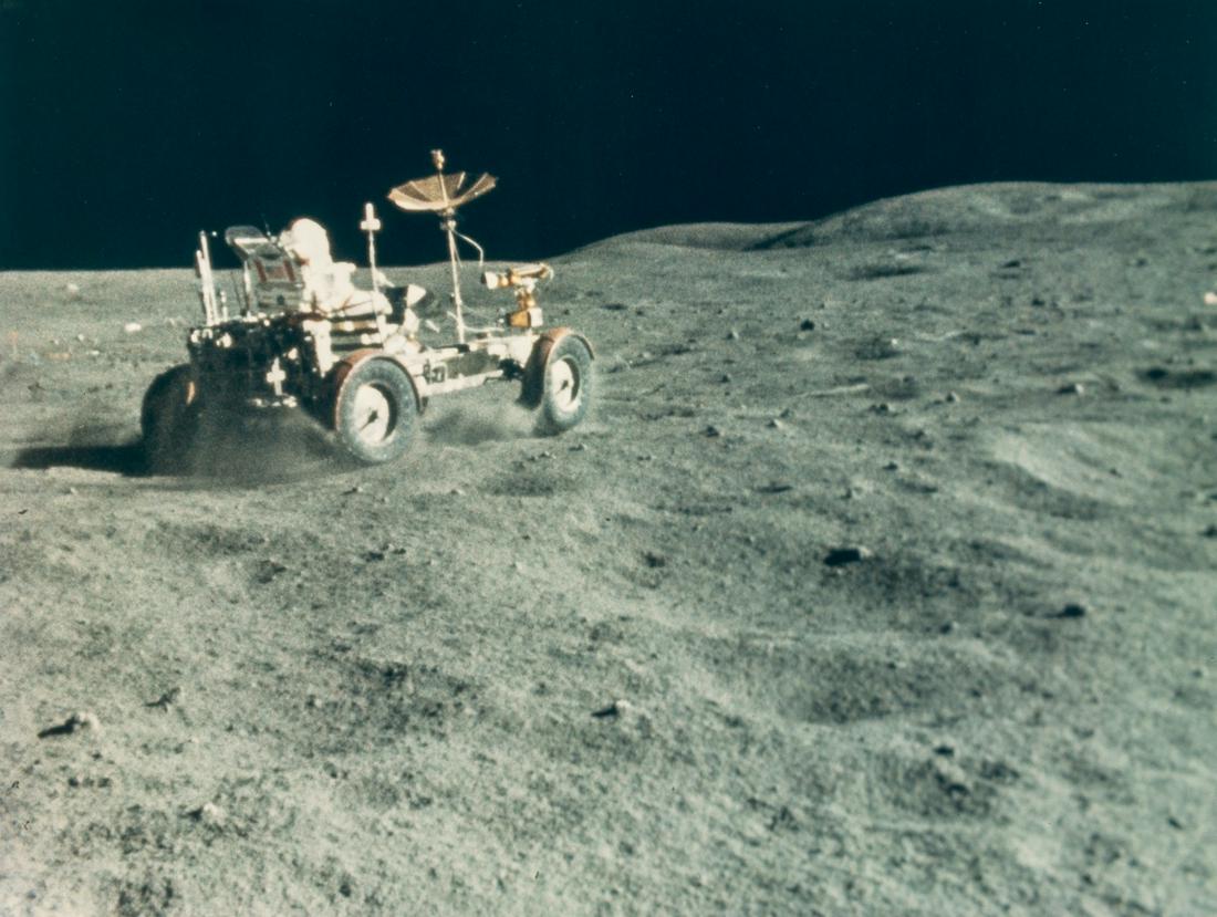 Apollo 16.- Duke (Charles) John Young drives the Rover (1 of 2)