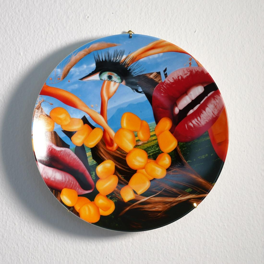 ** Jeff Koons (b.1955) Lips Coupe Plate: ** Jeff Koons (b.1955)Lips Coupe PlateGlazed Limoges porcelain multiple, 2013, numbered from the edition of 2500, published by Bernardaud, France, diameter 310mm (12 1/4in)This lot is currently stored