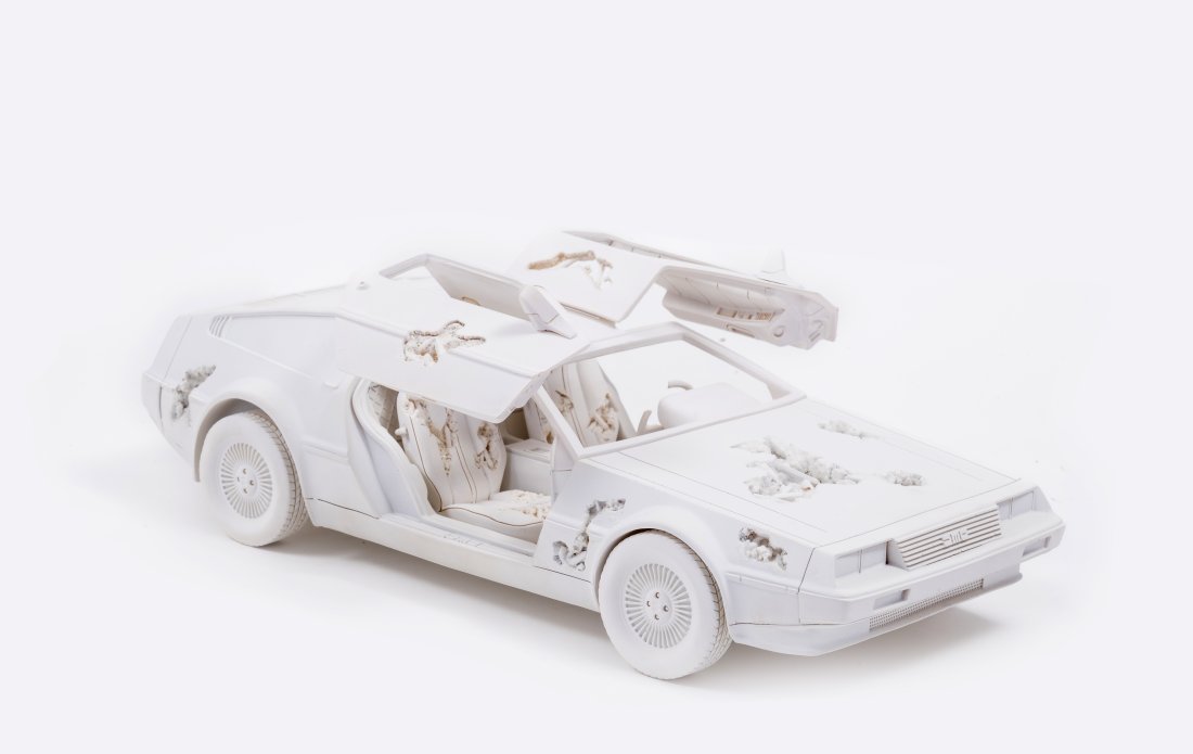 Daniel Arsham (b.1980) Eroded Delorean: Daniel Arsham (b.1980)Eroded Delorean Resin, plaster and aluminium oxide multiple, 2021, numbered from the edition of 500, authenticated by an Arsham Editions holographic seal of authenticity on the o