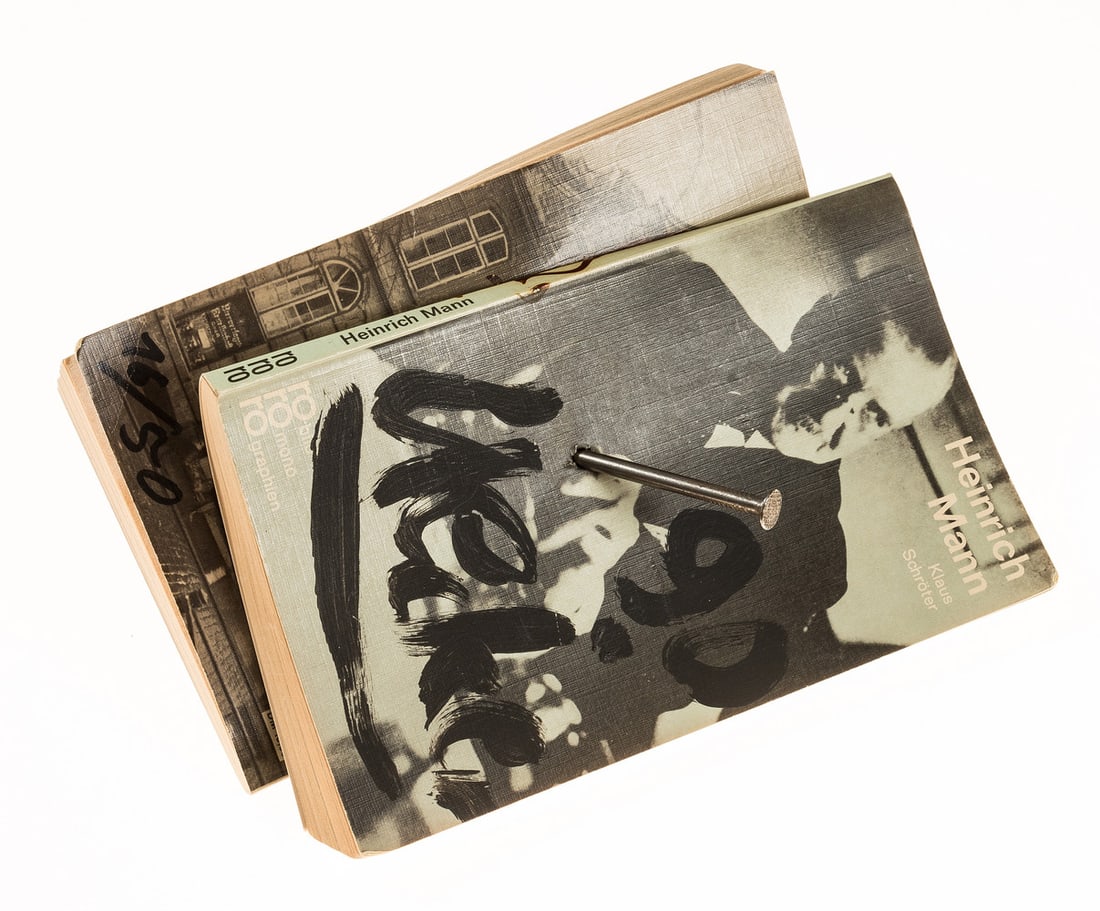 Uecker (Günther ) Heinrich and Thomas Mann, number 16 of 50 copies, signed and dated by the artist,: Uecker (Günther ) Heinrich and Thomas Mann, 2 paperback books pierced by a large nail with cork in end, number 16 of 50 c