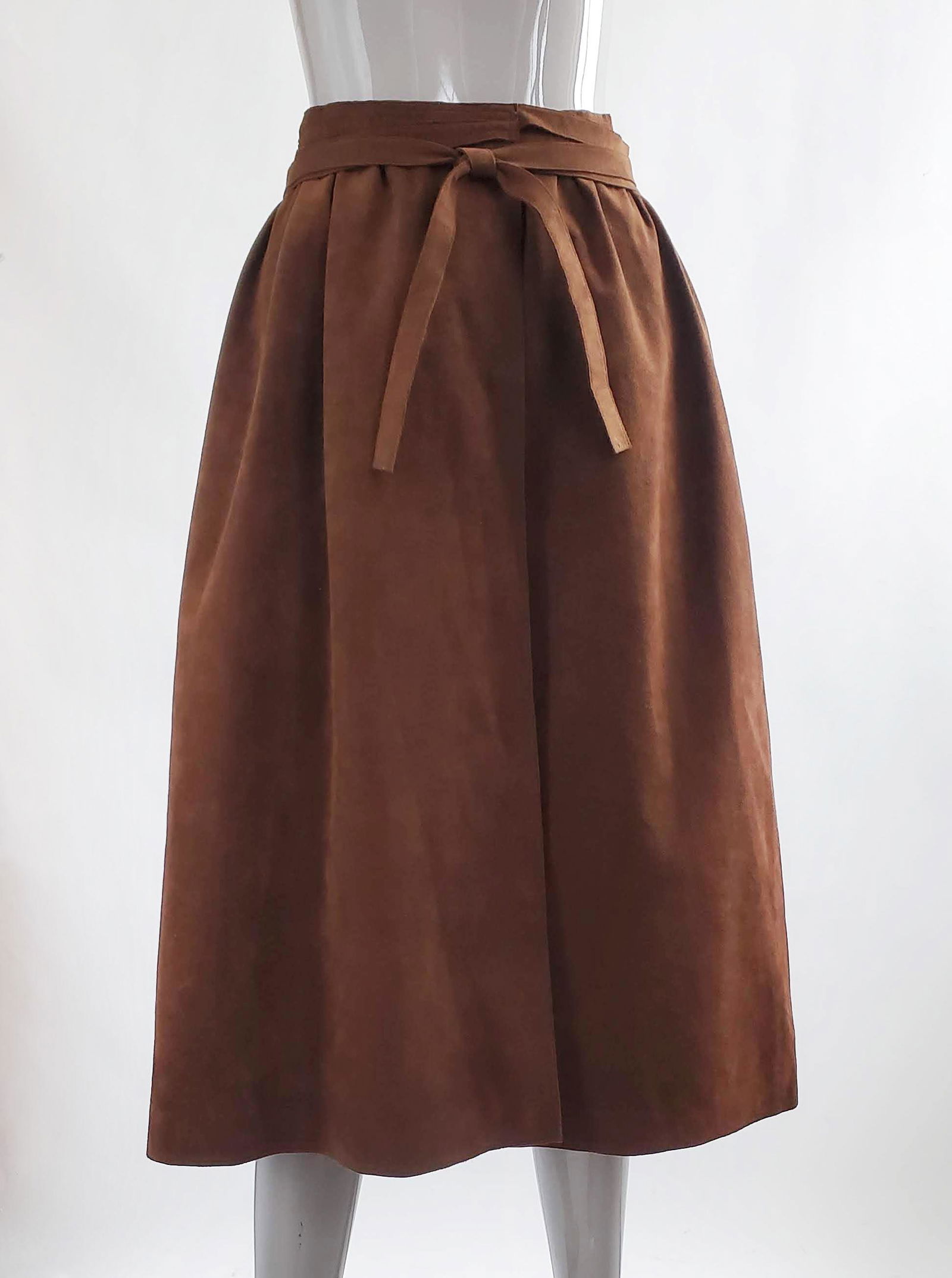 Halston Brown Ultrasuede Wrap Skirt, 1970s: Halston Sportswear Brown Ultrasuede Wrap Skirt, F/W 1979. Short-lived Halston Sportswear line was introduced in the Fall 1979 season. It was shown along with Halston mainline collection in the Vogue a