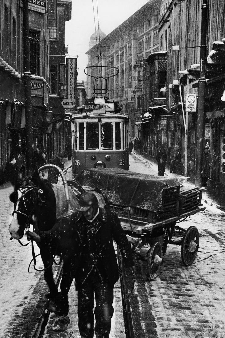 Ara Guler (1928-2018) Istanbul B&W Photo: Ara Guler (Turkish/ Armenian, 1928-2018) 'Istanbul' (Horse carriage & tram) 9 3/8" x 13 3/4" (24cm x 35cm). Labelled on the back. Photo originally taken in the mid 1950s, this is a later print. Photo 