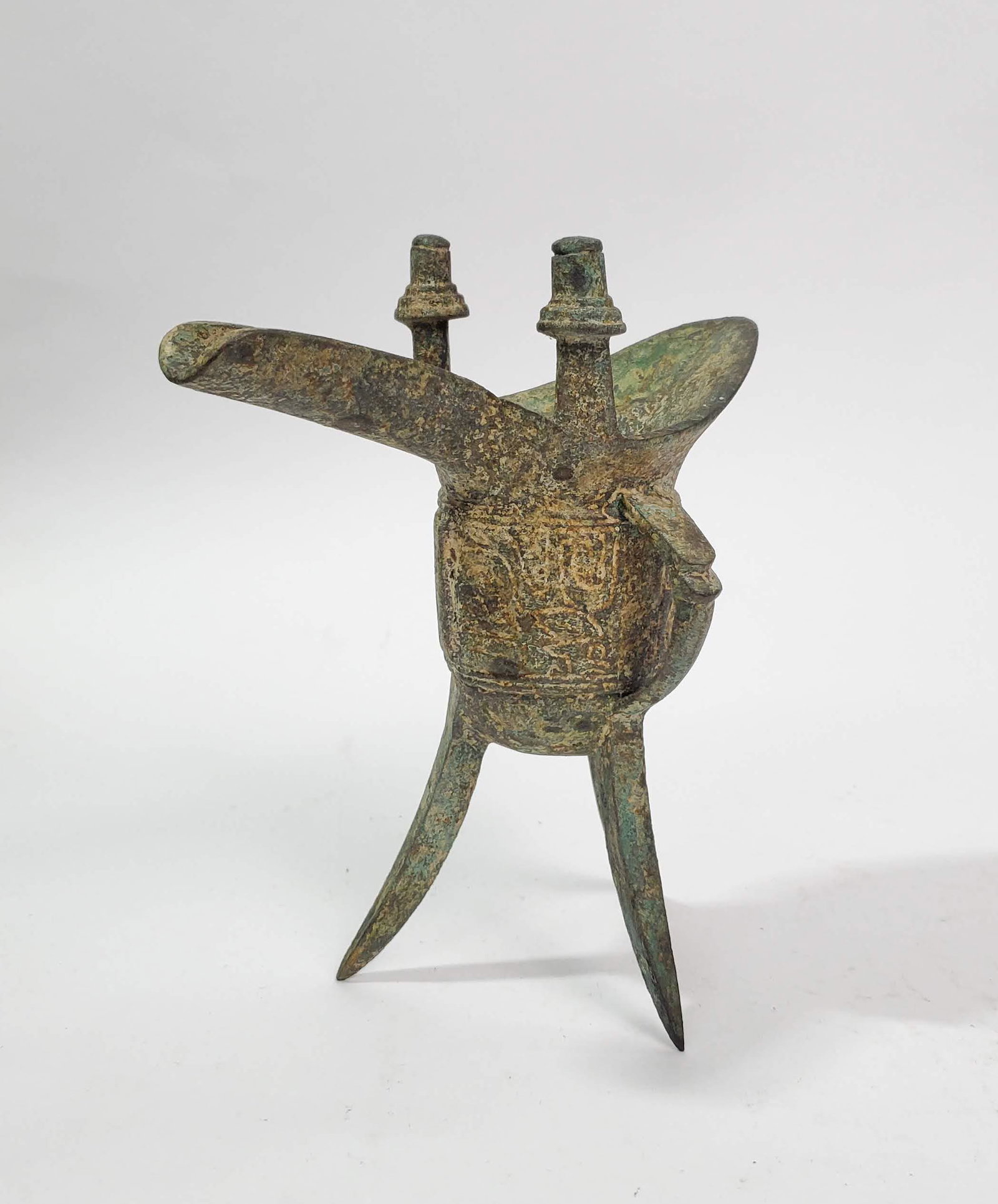 Antique Chinese Archaic Bronze Jue Wine Vessel: Antique Chinese Archaic Bronze Jue Ritual Tripod Wine Vessel, h. 6.75 in. Possibly late Shang Dynasty, or later copy.
