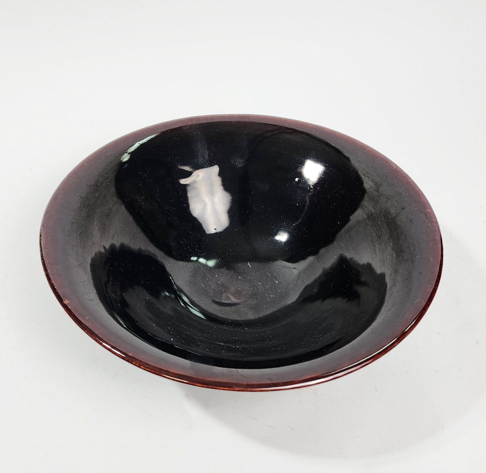 Chinese Dark Brown Glazed Porcelain Bowl: Chinese Dark Brown Glazed Porcelain Bowl, ca. 20th century. D. 10.25 inches, h. 3.5 inches.