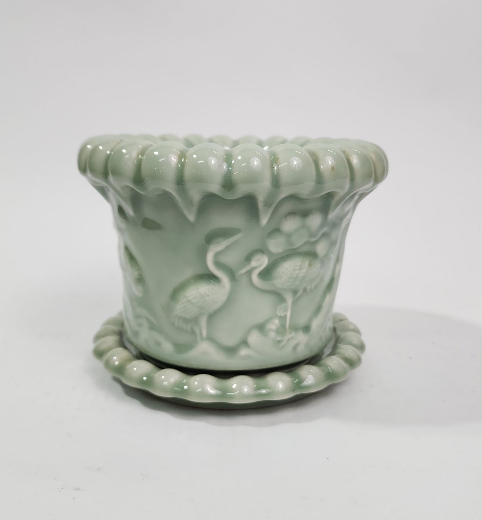Chinese Celadon Glazed Porcelain Moulded Planter & Saucer: Chinese Celadon Glazed Porcelain Moulded Planter & Saucer, c. 20th century, h. 5.25 inches.