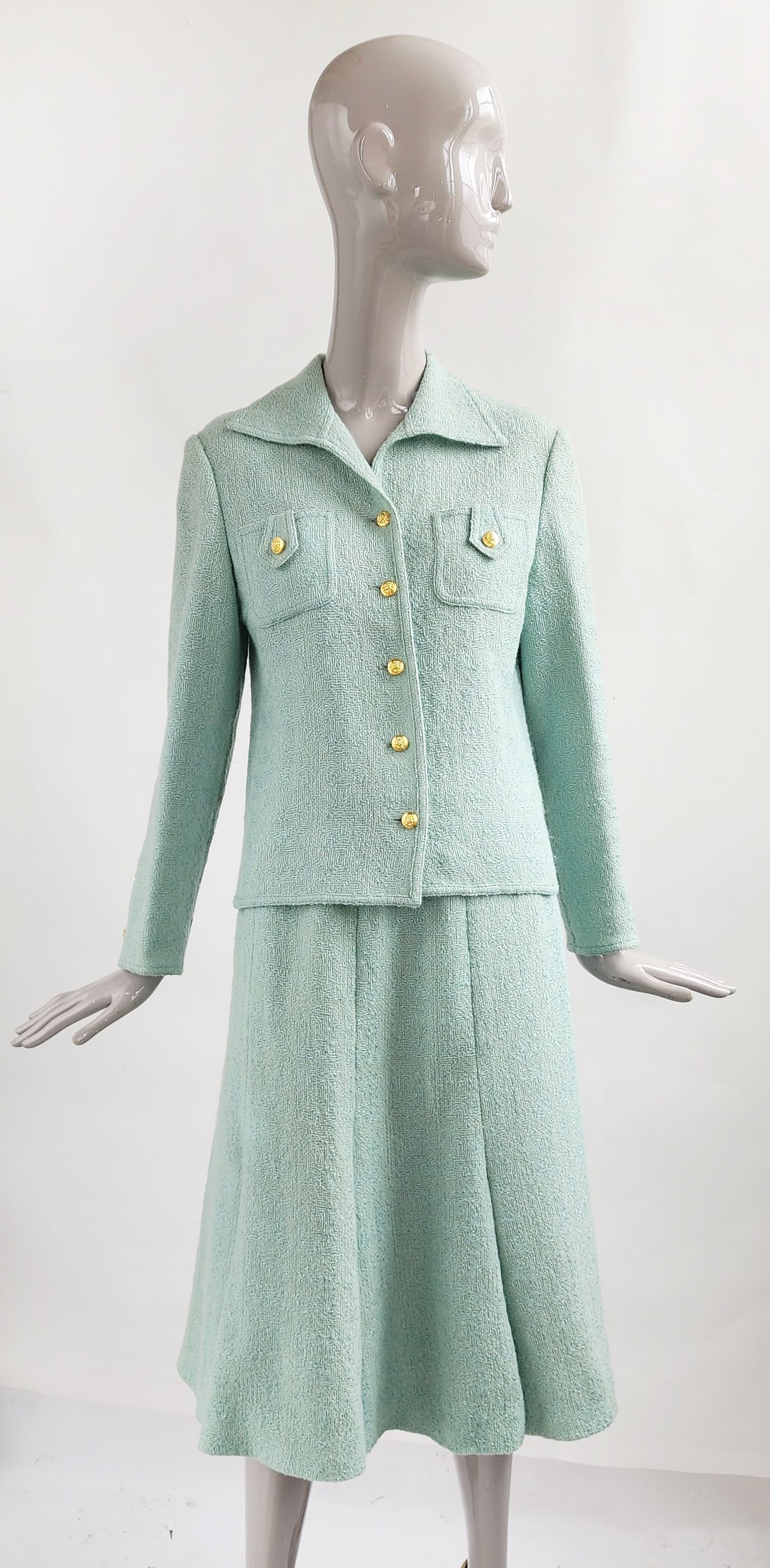 Auckie Sanft Linton Tweeds England Chanel Style Pale Green Suit, 1970s: Auckie Sanft Inc. Linton Tweeds Made in England Pale Green Wool Suit with Gold Tone Chanel Style Lion Head Buttons, 1970s.