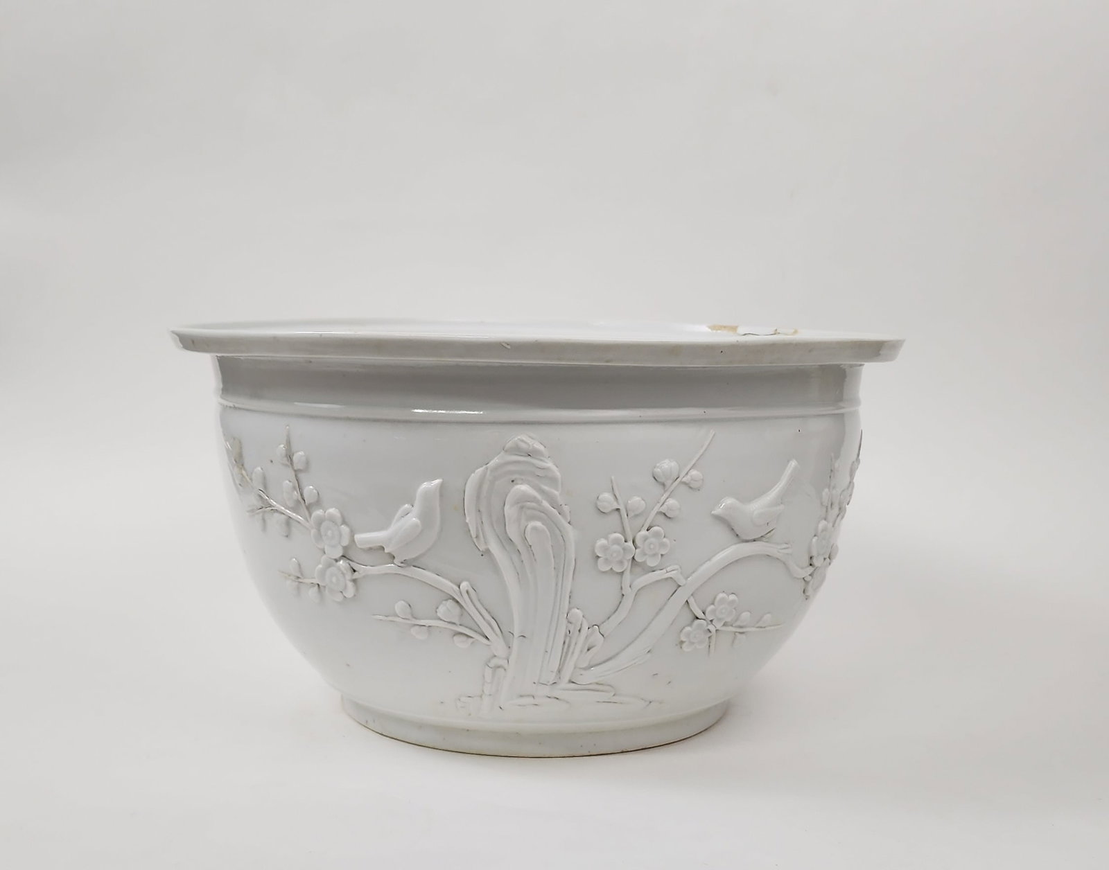 Antique Chinese Dehua Relief Decorated Porcelain Planter: Antique Chinese Dehua Relief Decorated Porcelain Planter, d. 13.5 inches, h. 7.5 in., ca. 19th century.