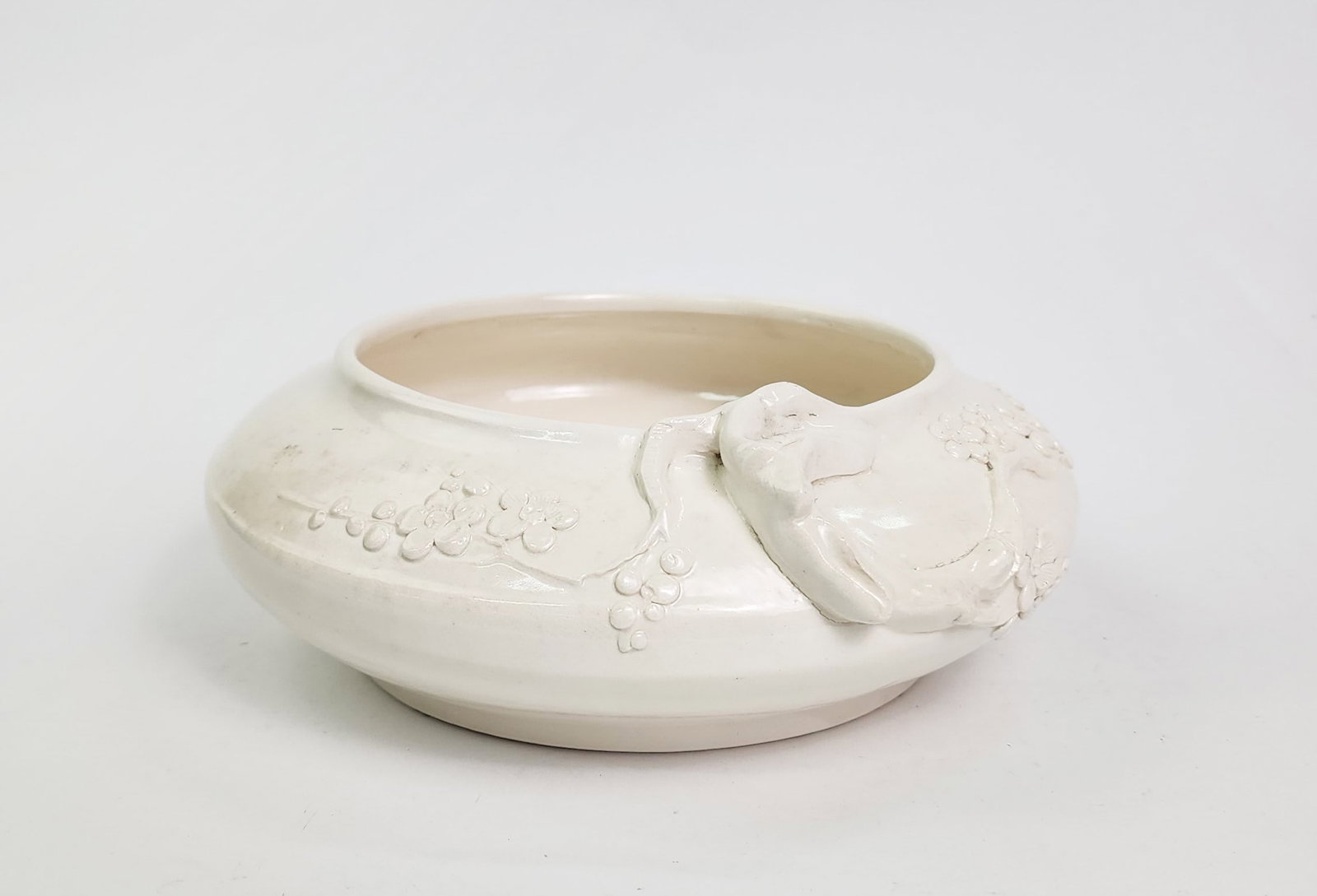 Antique Chinese Dehua Brush Wash Bowl with Moulded Decoration: Antique Chinese Cream Glazed Dehua Brush Wash Bowl with Moulded Decoration, d. 9 inches, h. 3.25 in., ca, 20th century.