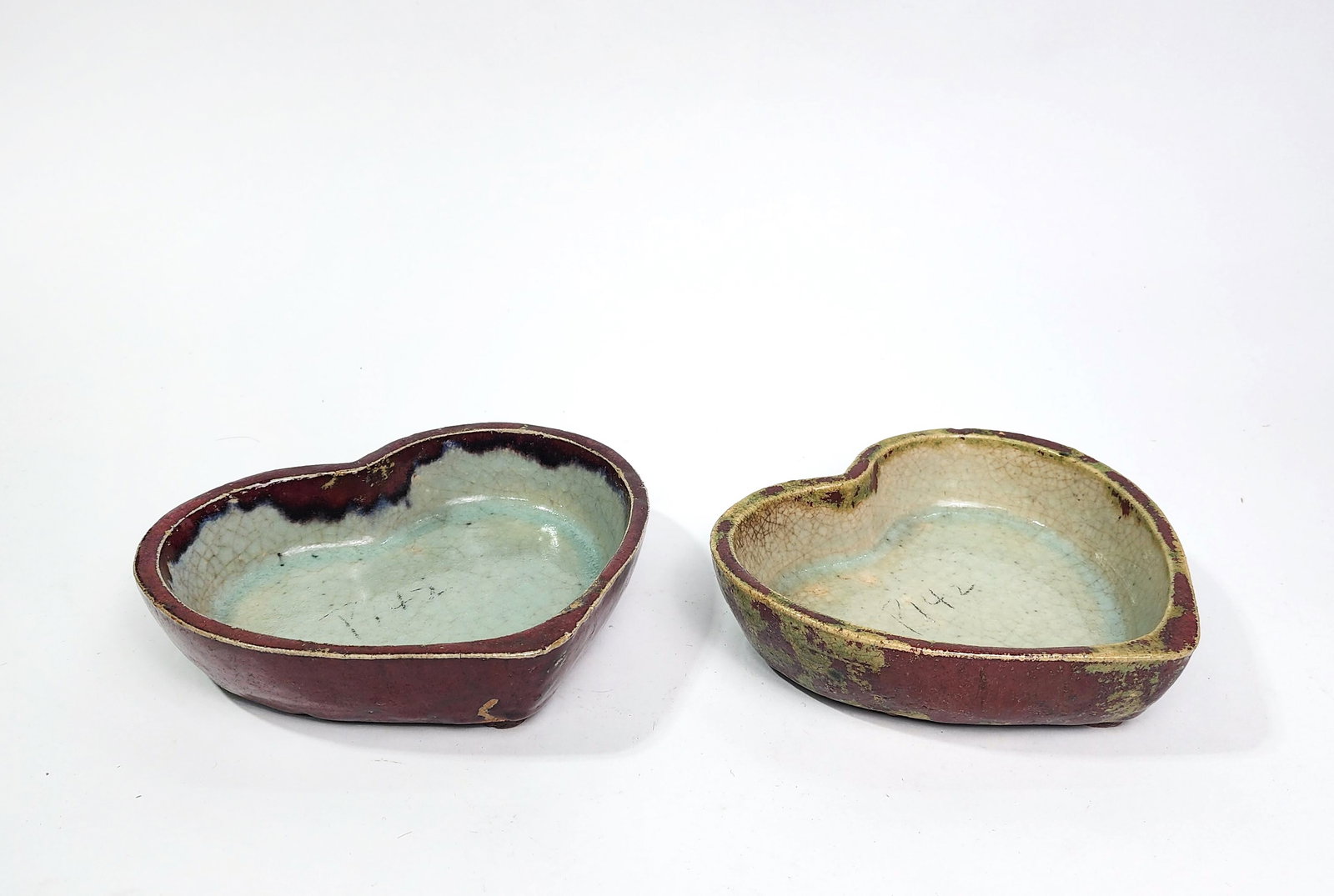 Pair of Chinese Export Red & Celadon Glazed Heart Shape Dishes: Pair of Chinese Export Red & Celadon Glazed Heart Shape Dishes, ca. Mid 20th century, w. 7.5 in., h. 1.75 inches.