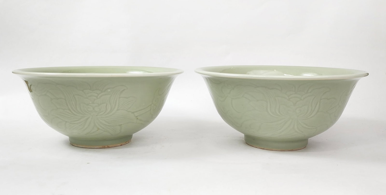 Pair of Vintage Chinese Longquan Celadon Porcelain Bowls: Pair of Vintage Chinese Longquan Celadon Porcelain Bowls, d. 10.5 inches, h. 4.5 in., ca. late 19th- early 20th century. Provenance: Estate of a New York collector/ dealer. The collection assembled be