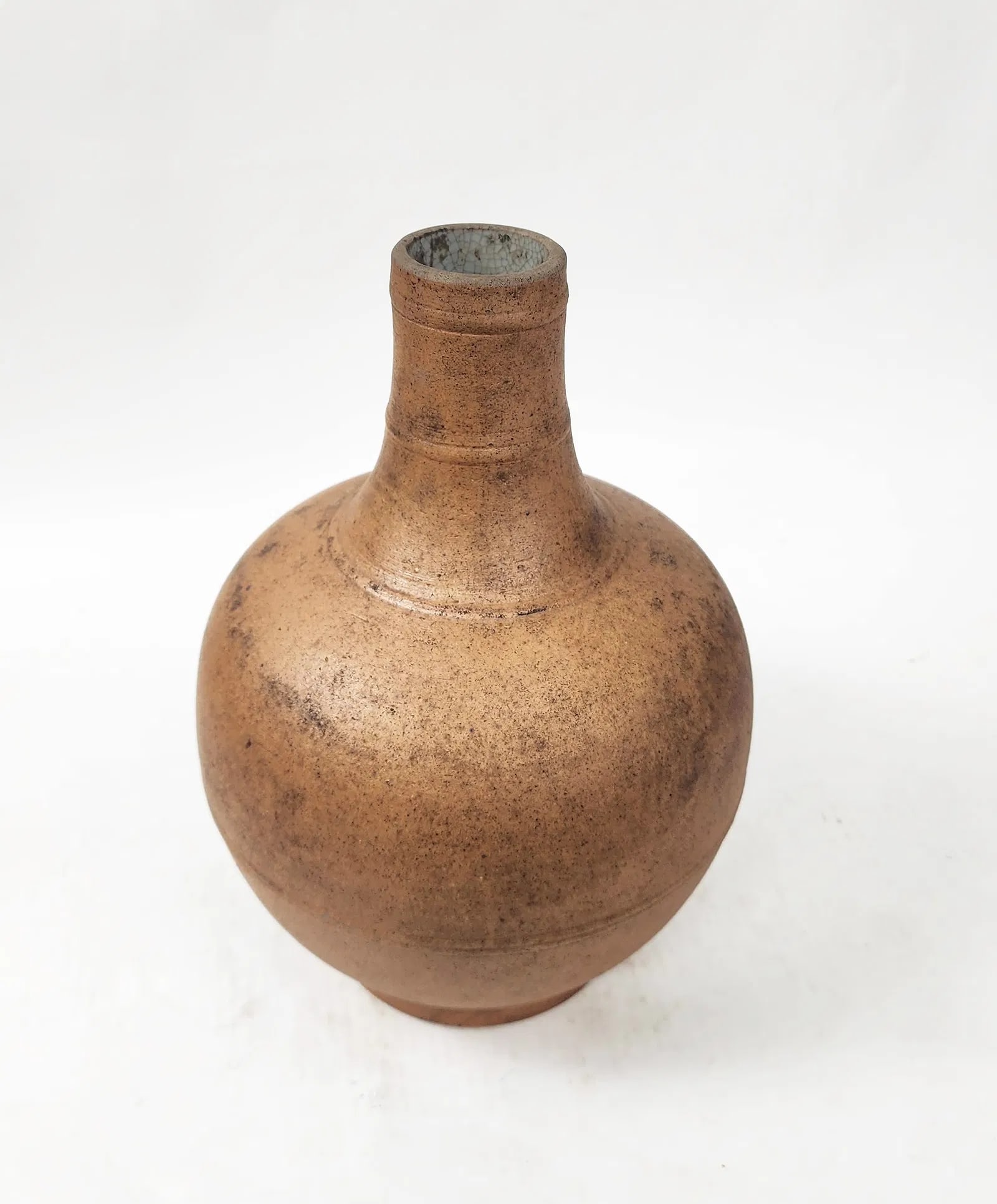 Antique Chinese Brown Pottery Bottle Shaped Vase: Antique Chinese Unglazed Brown Pottery Bottle Shaped Vase with Glazed Interior, h. 12.25 inches, ca. late 19th - early 20th century. Provenance: Estate of a New York collector/ dealer. The collection 