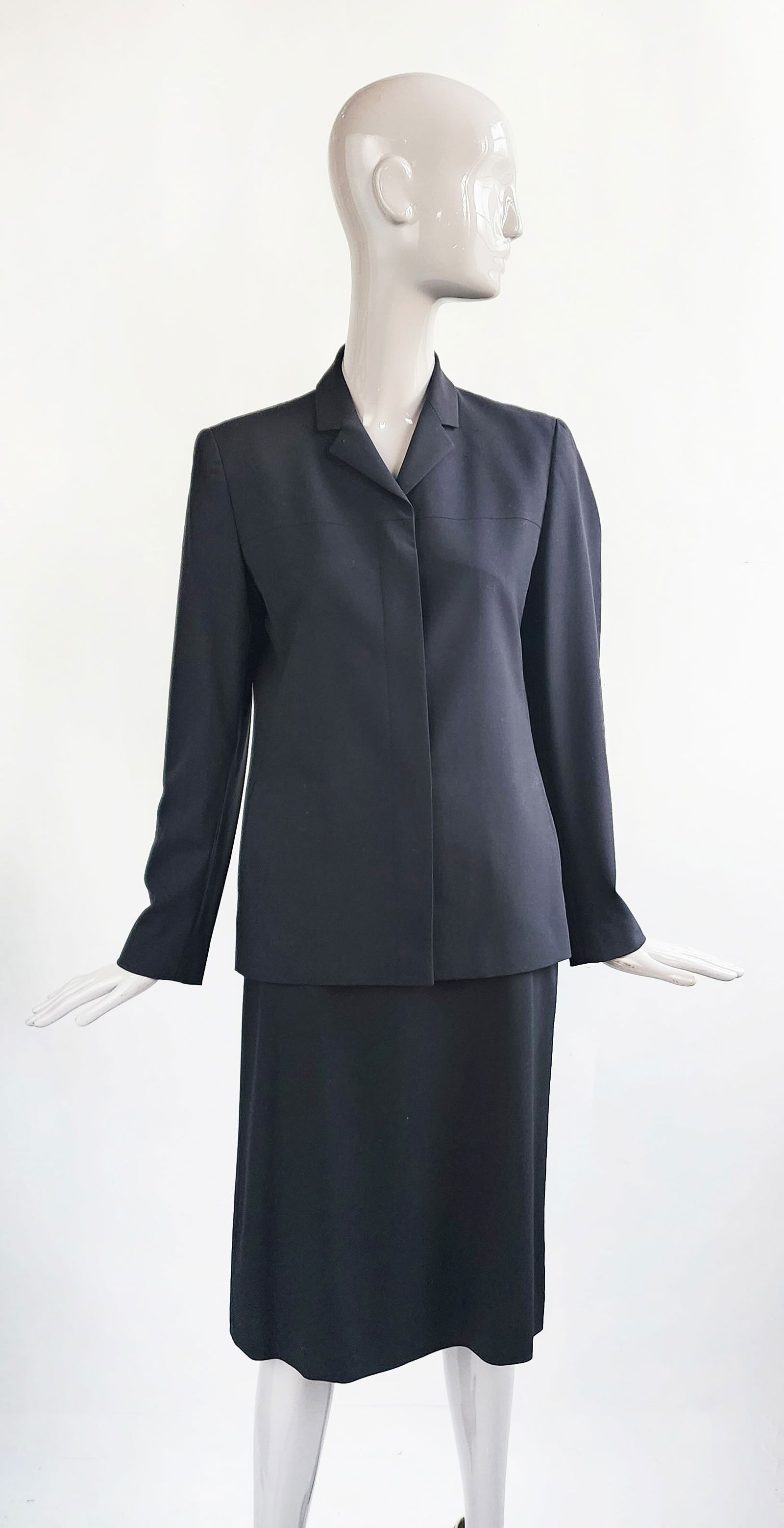 Calvin Klein Collection Black Wool Skirt Suit, F/W 2000: Calvin Klein Collection Black Wool Skirt Suit, Fall/ Winter 2000. Made in Italy. Jacket size 10, skirt size 8. Provenance: Estate of Mary Stone Phipps (1936-2022) (Mrs. Howard Phipps Jr.), Erchless Ho