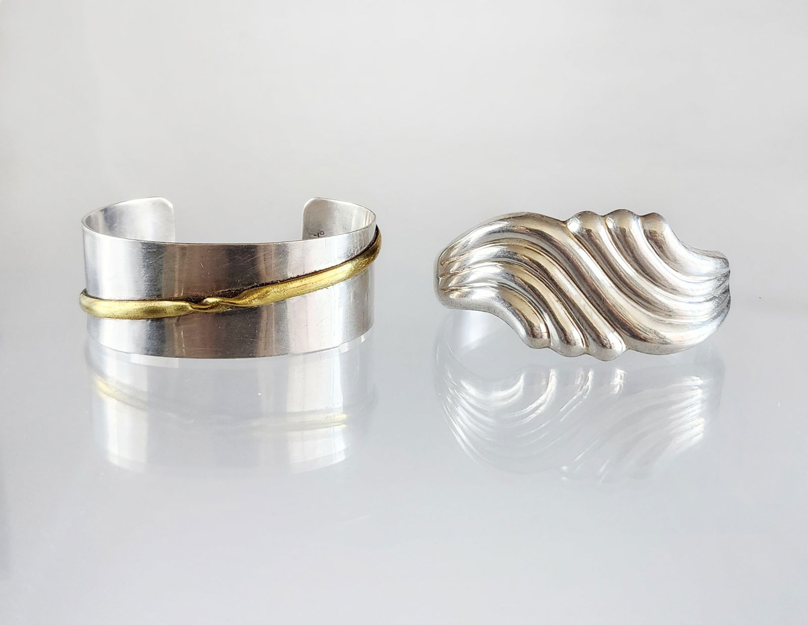 Estate Vintage Lot of 2 Sterling Silver Mexican Modernist Cuff Bracelets: Estate Vintage Lot of 2 Sterling Silver Mexican Modernist Cuff Bracelets. Marks:1-Mexico/ 925/ TF 63 Total weight: 75 grams.(2) Provenance: Estate of Victoria Salter (1944-2024) Victoria Salter was th