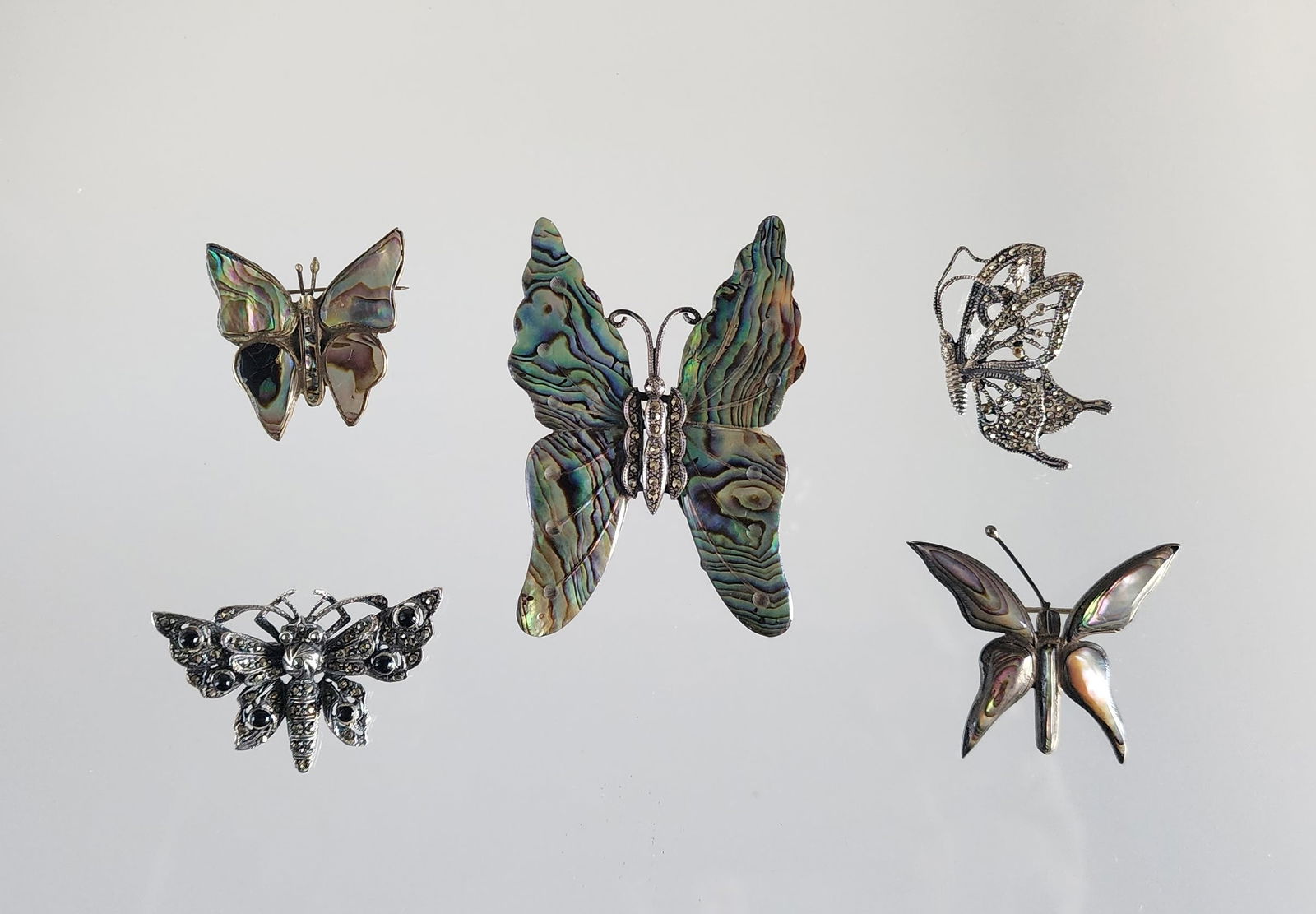 Estate Vintage Lot of 5 Sterling Silver & Gemstone Butterfly Brooches: Estate Vintage Lot of 5 Sterling Silver & Gemstone Butterfly Brooches. Including; with abalone, hematite, onyx. Marks: 925, A 925, Gonzalez/ Sterling/ Mexico/ 925, and two unmarked. Total weight: 42 g