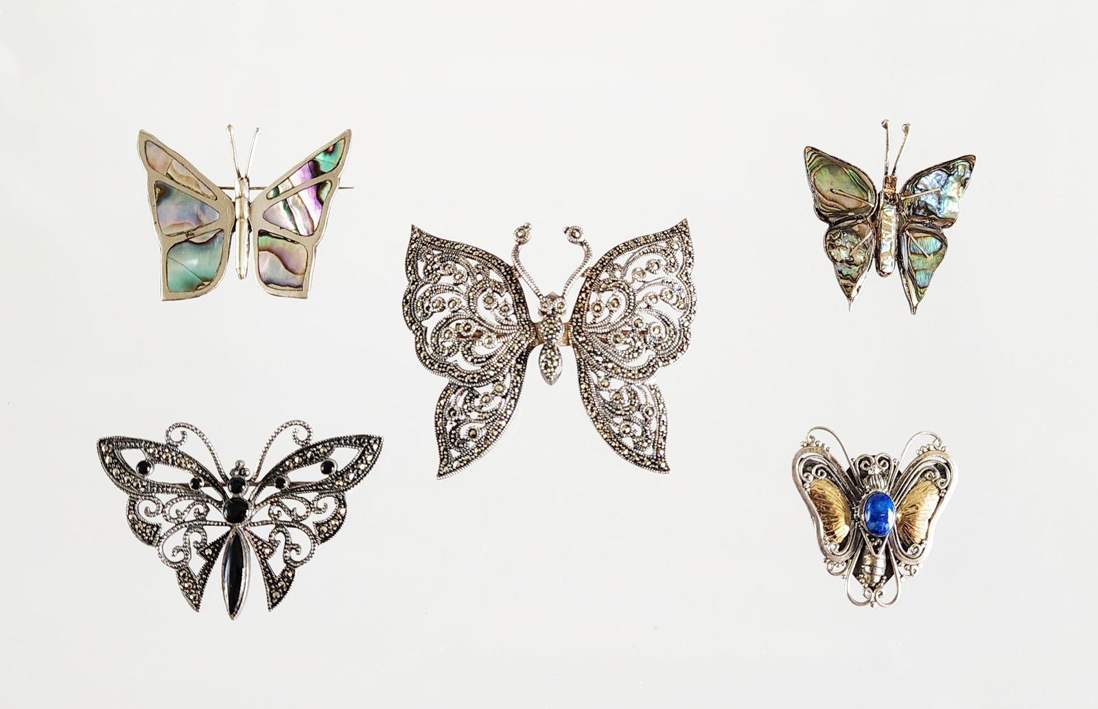 Estate Vintage Lot of 5 Sterling Silver & Gemstone Butterfly Brooches: Estate Vintage Lot of 5 Sterling Silver & Gemstone Butterfly Brooches. Including; with abalone, hematite, onyx and sodalite. Marks: 925, Sterling/ 925/ Mexico, RR 925/ Hecho en Mexico/ Total weight: 4