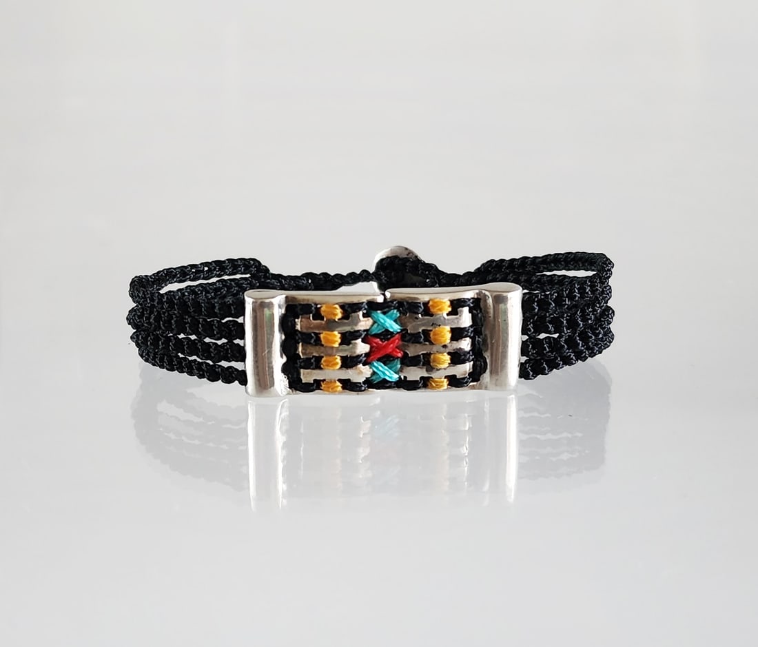 Estate Vintage Babylonia of Greece Sterling Silver & Cord Mens Bracelet: Estate Vintage Babylonia of Greece Sterling Silver & Hand Knotted Cord Mens Bracelet. Marks: Babylonia/ 950 Total weight: 16 grams. Provenance: Estate of Victoria Salter (1944-2024) Victoria Salter wa