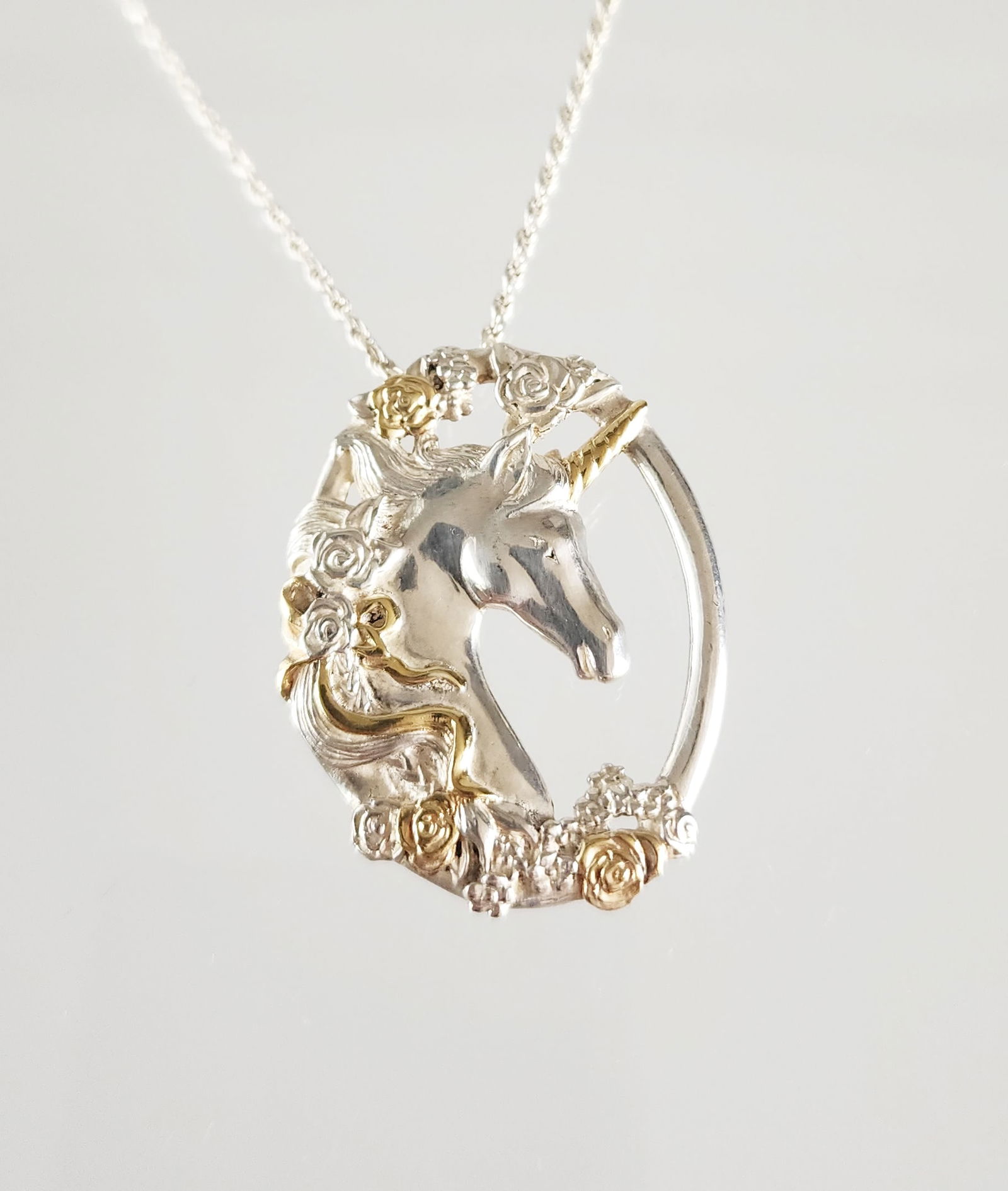 Estate Vintage Gorham Sterling Silver Unicorn Pendant: Estate Vintage Gorham Two Toned Gold Wash on Sterling Silver Unicorn Pendant with 20 in. chain. Marks: Gorham Sterling (pendant), 925 Italy (chain). Total weight:22 grams. Provenance: Estate of Victor