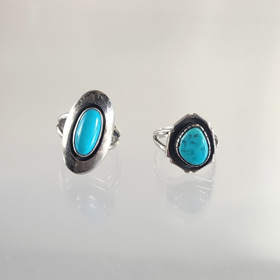 Estate Vintage Lot of 2 Native American Navajo Sterling Silver & Turquoise Rings: Lot of 2 Estate Vintage Native American Navajo Sterling Silver & Turquoise Rings. Size 8.25 & 8.5. Marks: Sterling/ HJ(?), Sterling. Total weight: 10 grams. Provenance: Estate of Victoria Salter (1944